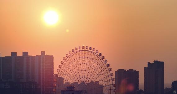 夕阳下的城市摩天轮高清在线视频素材下载