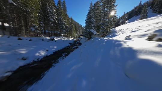 FPV无人机航拍瑞士冬日日出雪山河流树林