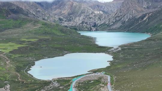 航拍四川甘孜巴塘海子山姊妹湖高原牧场风光